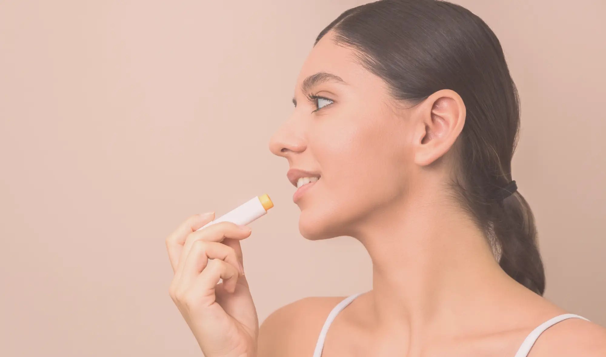 woman applying lip balm