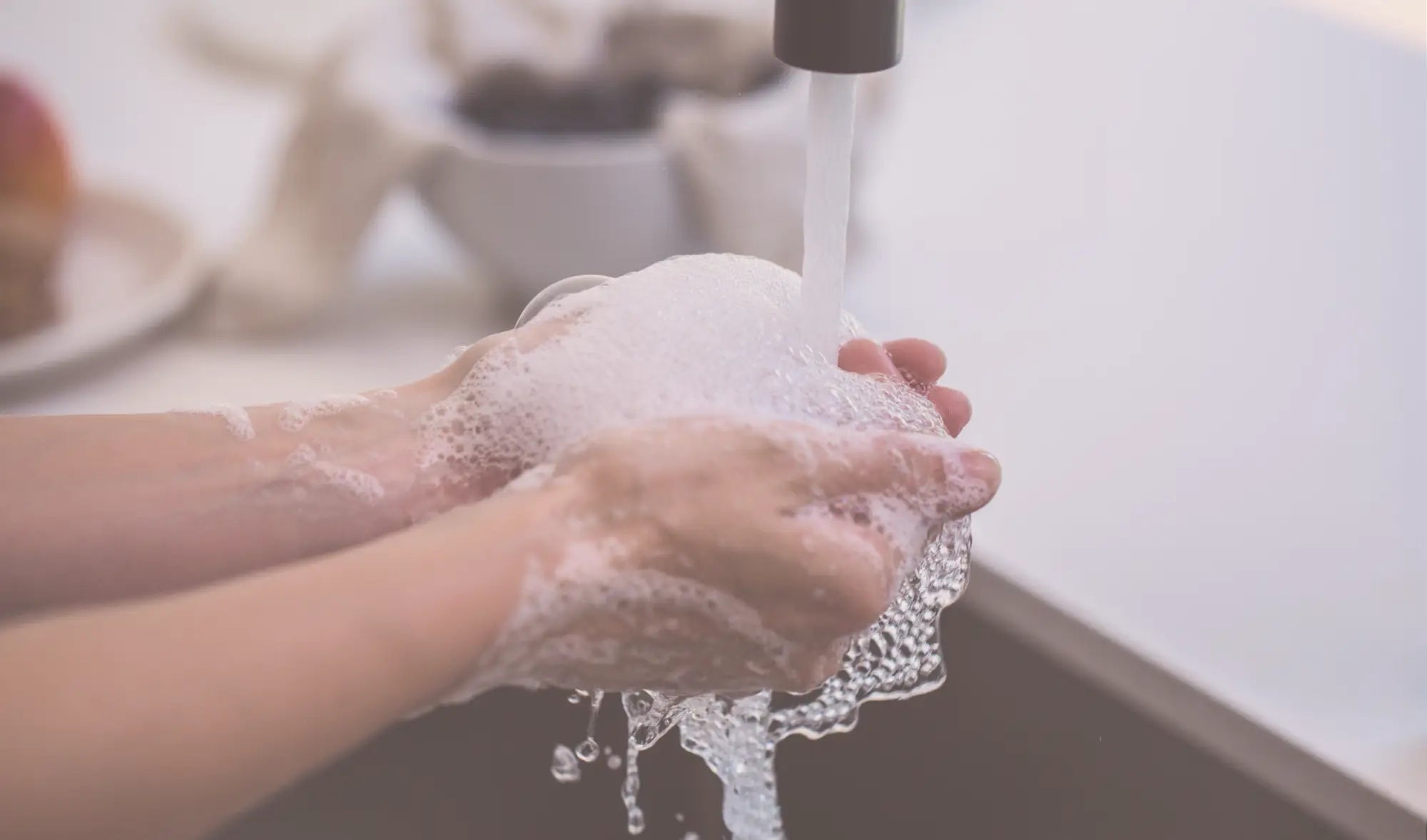 washing hands with foaming soap