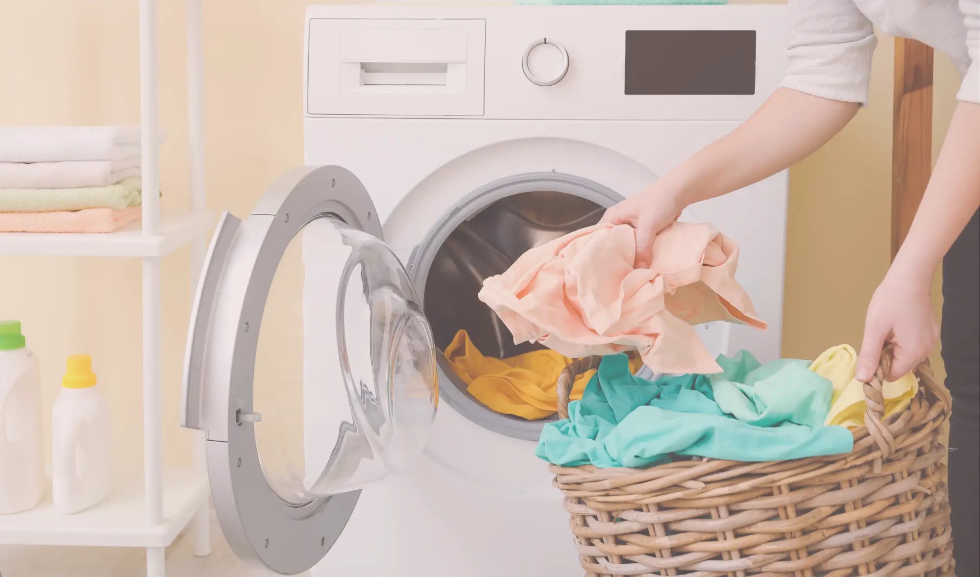 loading a washing machines with clothes