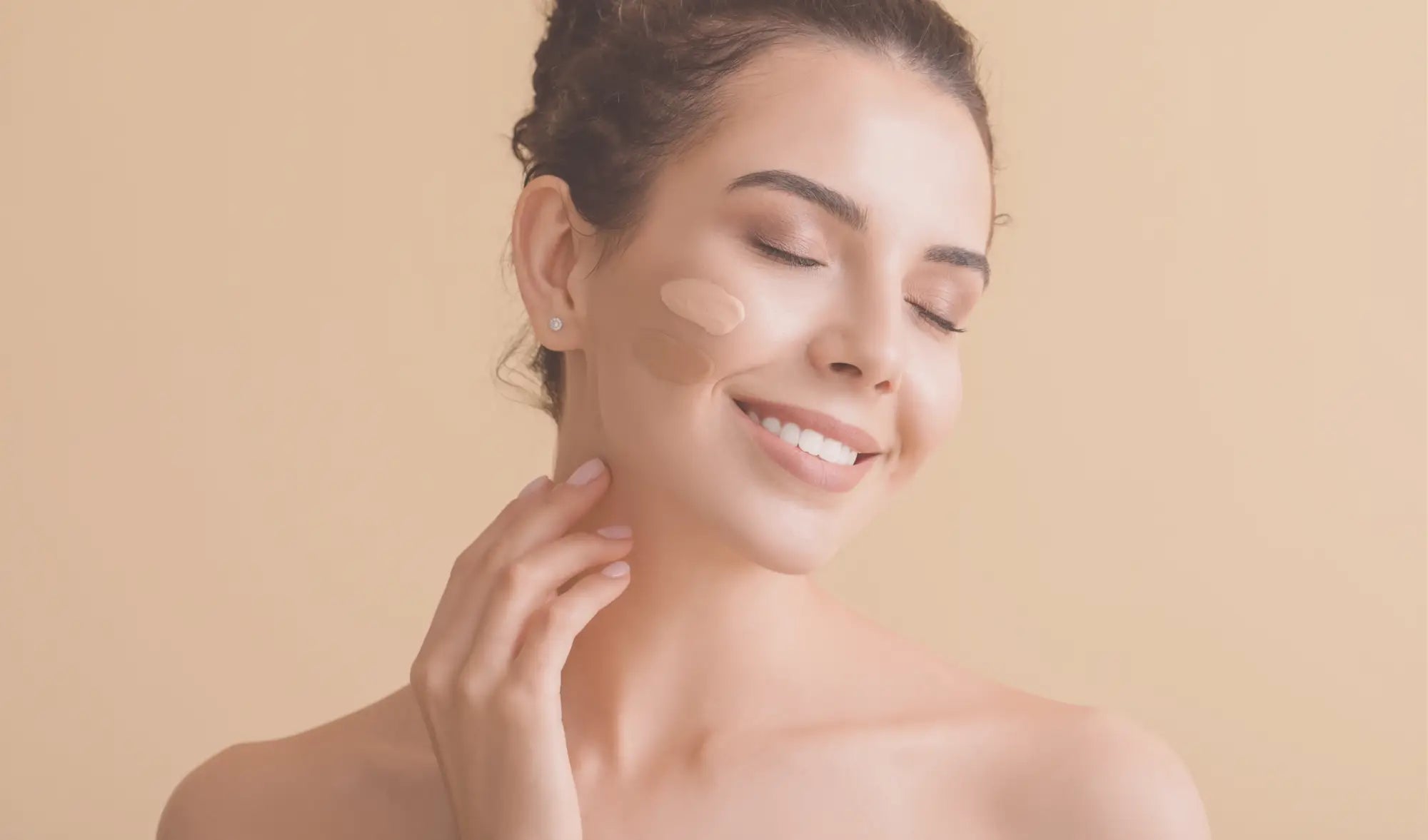 woman with two foundation swatches on cheek