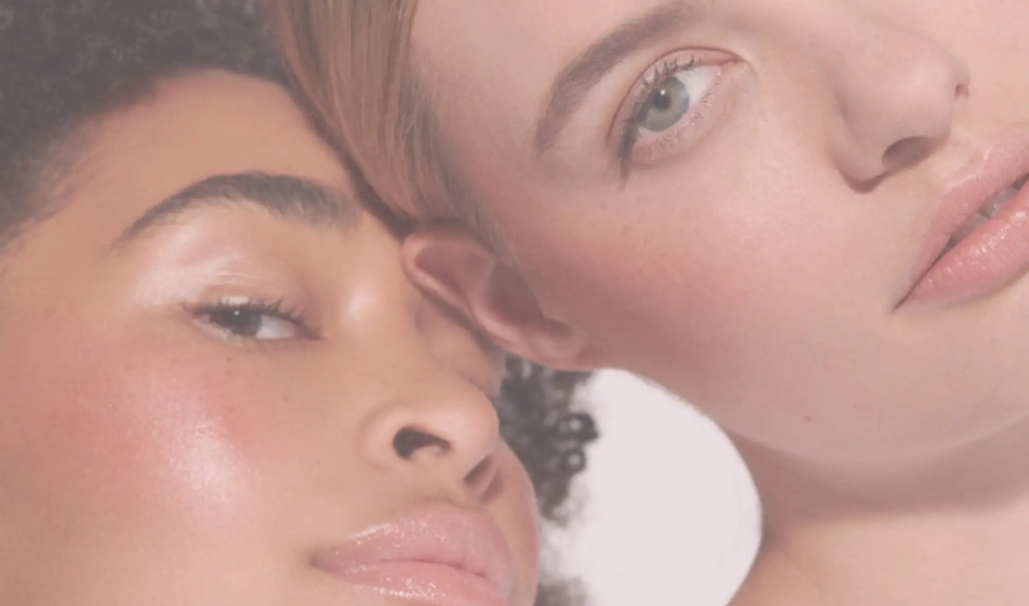 close up of two faces of two women with natural makeup and glowing skin