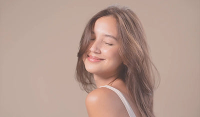 Teen girl smiling with eyes closed