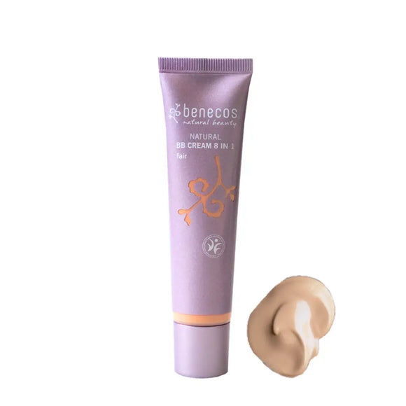 Purple tube of Benecos BB cream with a small dollop of beige-colored product beside it.