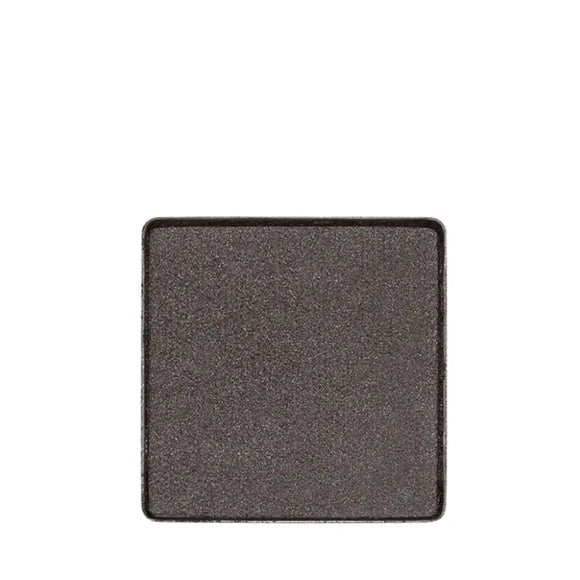 Square pan of dark gray eyeshadow with a subtle shimmer.