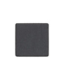 Square of dark gray eyeshadow or pressed powder makeup.