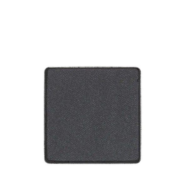 Square of dark gray eyeshadow or pressed powder makeup.