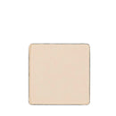 Square-shaped beige or cream-colored tile or ceramic piece with slightly rough edges.