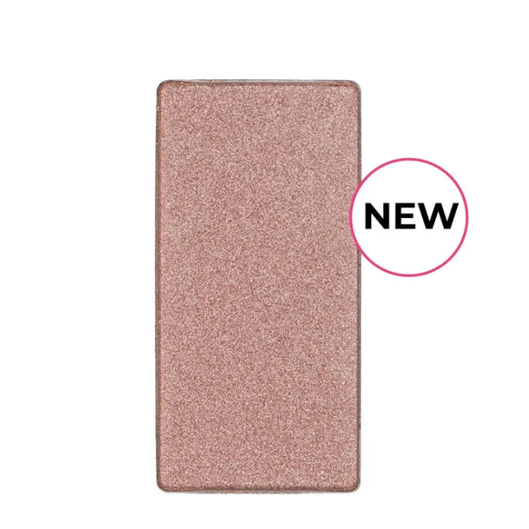 Shimmery rose gold eyeshadow pan with a ’NEW’ label.