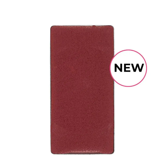 Rectangular burgundy-colored object with a ’NEW’ label.