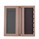 Empty makeup palette with a mirror and slots for cosmetic products.