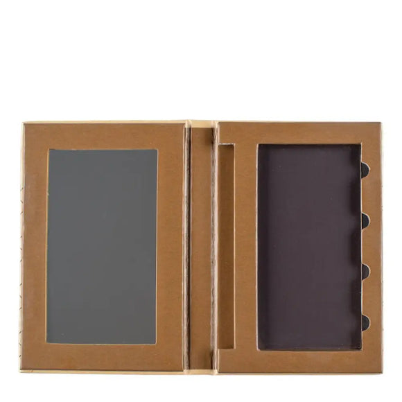 Empty makeup or eyeshadow palette with two compartments in a gold-colored case.