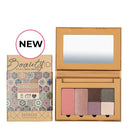 Makeup palette with eyeshadows and blush in a cardboard packaging featuring a Moroccan-inspired design.