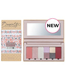 Makeup palette with multiple eyeshadow and blush colors in a pink case with a mirror.