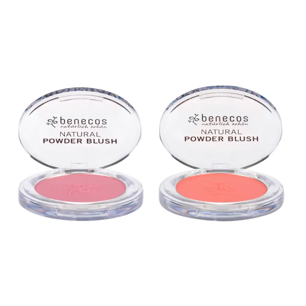 Two open compacts of Benecos natural powder blush in pink and coral shades.