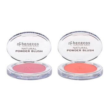 Two open compacts of Benecos natural powder blush in pink and coral shades.