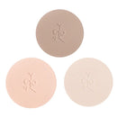 Three circular pressed powder compacts in different nude and beige tones with embossed floral designs.