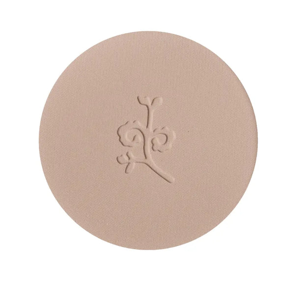 Circular pressed powder compact with an embossed floral design.