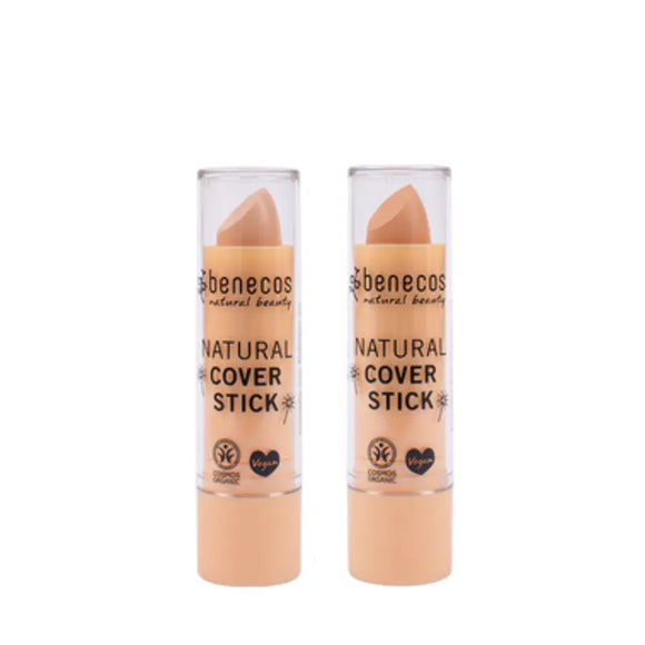 Two beige Benecos natural cover stick concealers.