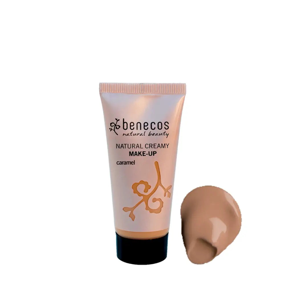 Tube of Benecos natural creamy makeup in caramel shade with a swatch of the product beside it.