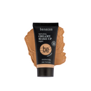 Tube of caramel-colored vegan makeup.