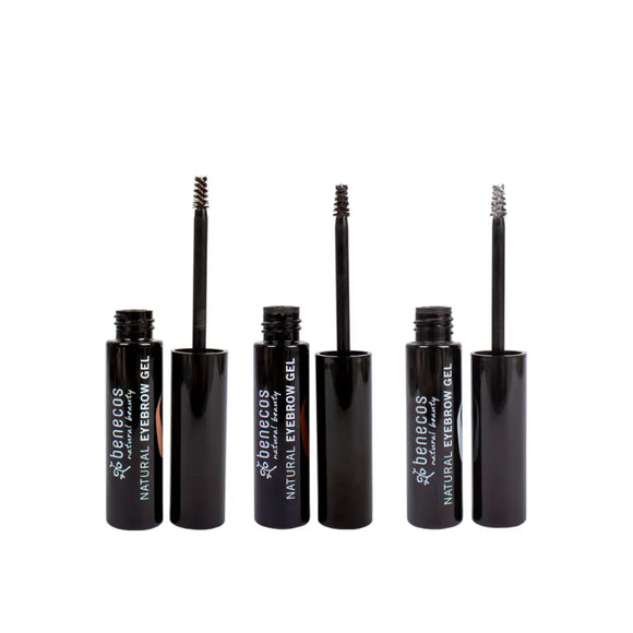 Three black mascara or eyebrow gel tubes with brushes.