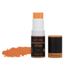Natural foundation stick in tan color with black and orange packaging.