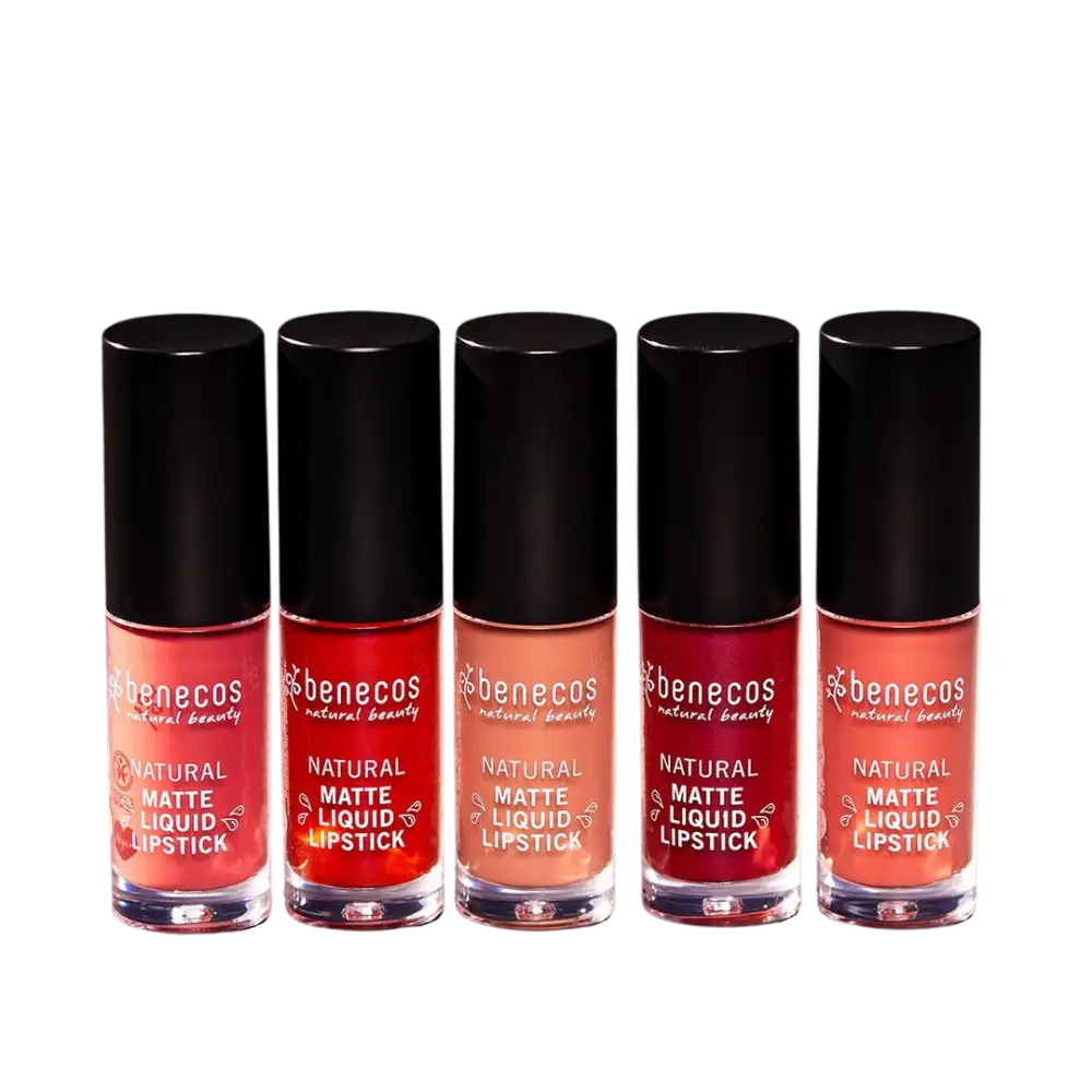 Five bottles of pink and red Benecos natural liquid lipstick arranged in a row.