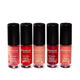Five bottles of pink and red Benecos natural liquid lipstick arranged in a row.