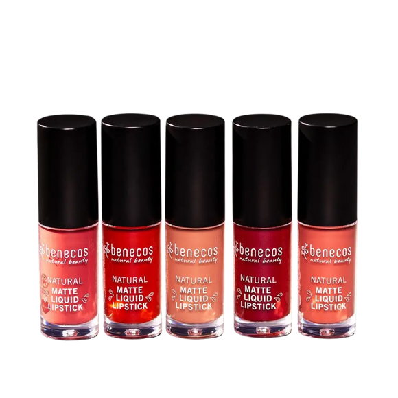 Five bottles of pink and red Benecos natural liquid lipstick arranged in a row.