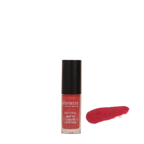 Red liquid matte lipstick in a clear glass bottle with black cap and a red swatch beside it.