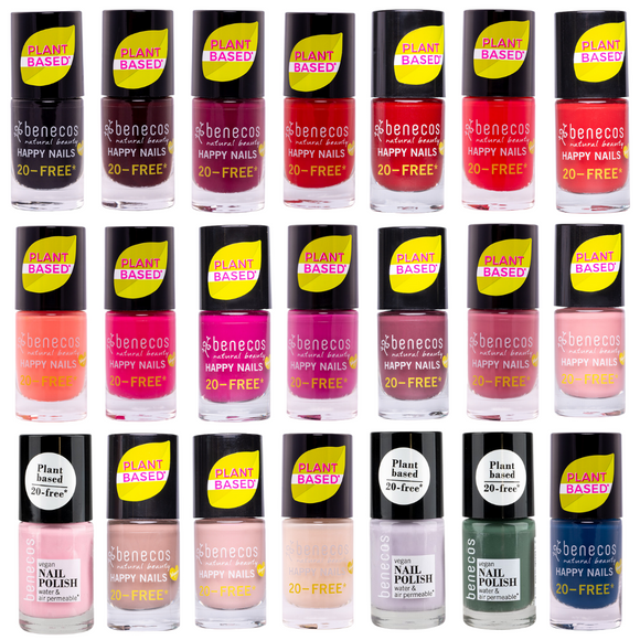 Collection of plant based nail polish bottles in various shades of pink, red, nude, blue, coral and pale pink