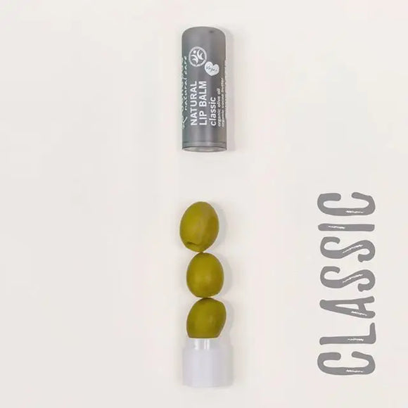 Three green olives stacked vertically on a white base.