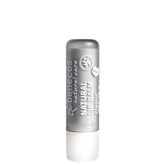 Silver and white lip balm tube with natural product labeling.