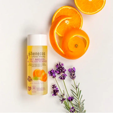 Yellow bottle of Benecos natural beauty product with orange and lavender accents.