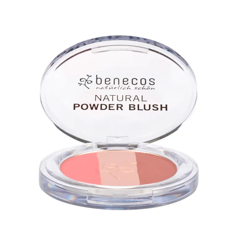 Benecos natural powder blush compact in coral-peach tones with clear plastic casing.