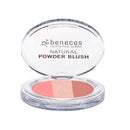 Benecos natural powder blush compact in coral-peach tones with clear plastic casing.