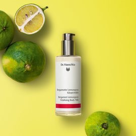 Bottle of body milk with a pump dispenser.