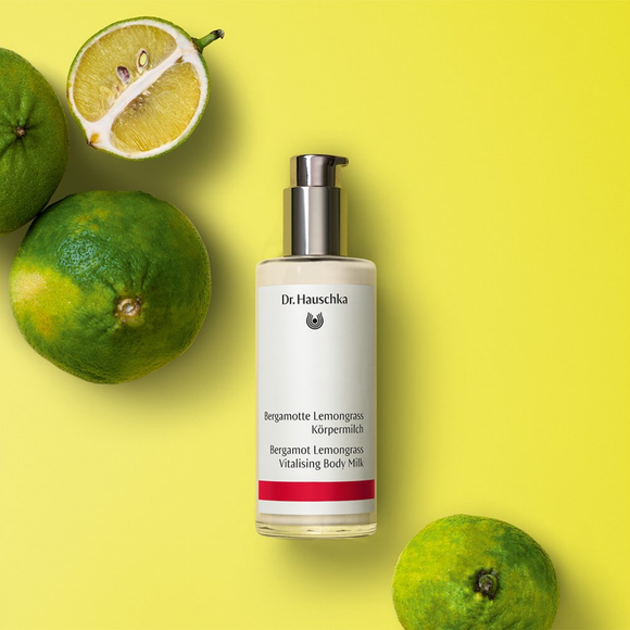 Bottle of body milk with a pump dispenser.