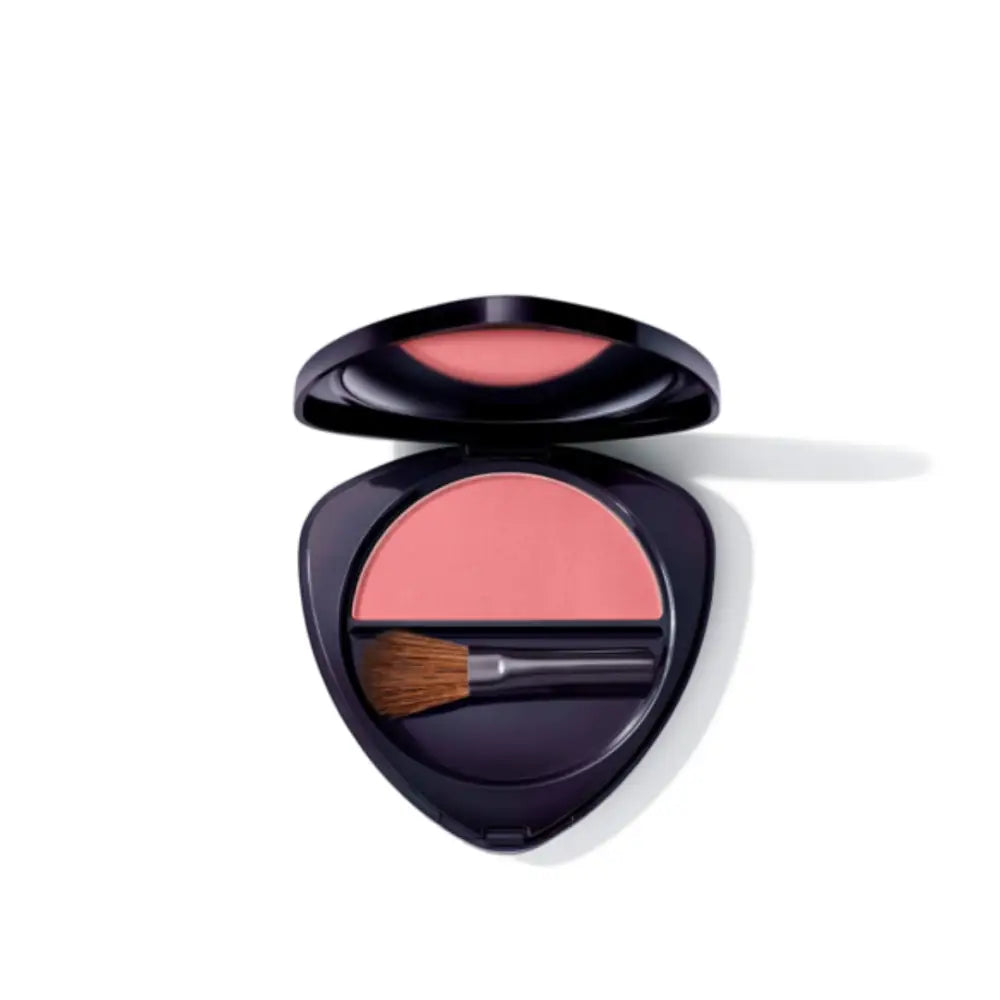 Pink powder blush in a black compact with a brush.