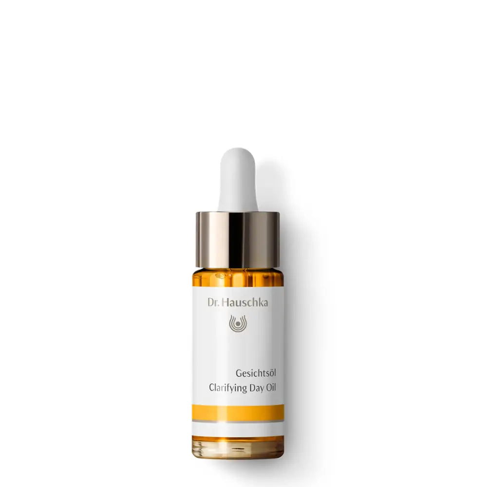 Glass bottle of Dr. Hauschka Clarifying Day Oil with a dropper cap.