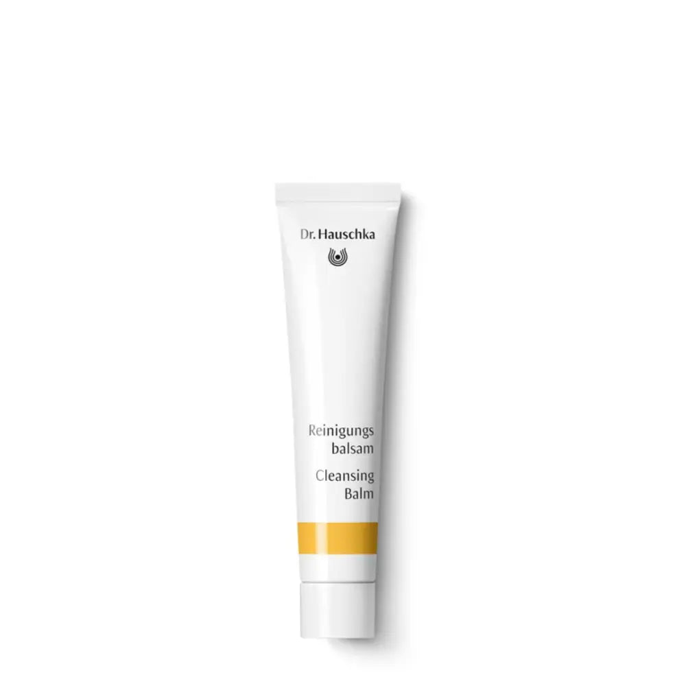 White tube of Dr. Hauschka Cleansing Balm with yellow accent stripe.