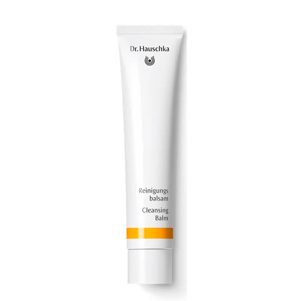 White tube of Dr. Hauschka Cleansing Balm with yellow accent stripes.