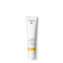 White tube of Dr. Hauschka Cleansing Cream with yellow accent stripe.