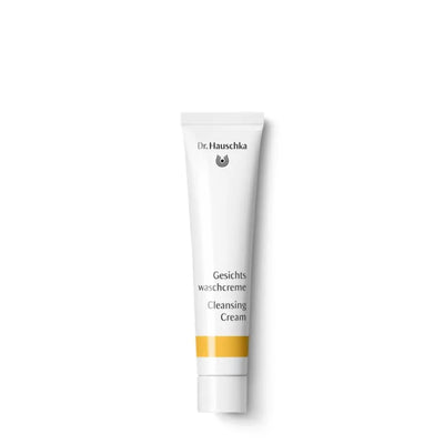 White tube of Dr. Hauschka Cleansing Cream with yellow accent stripe.