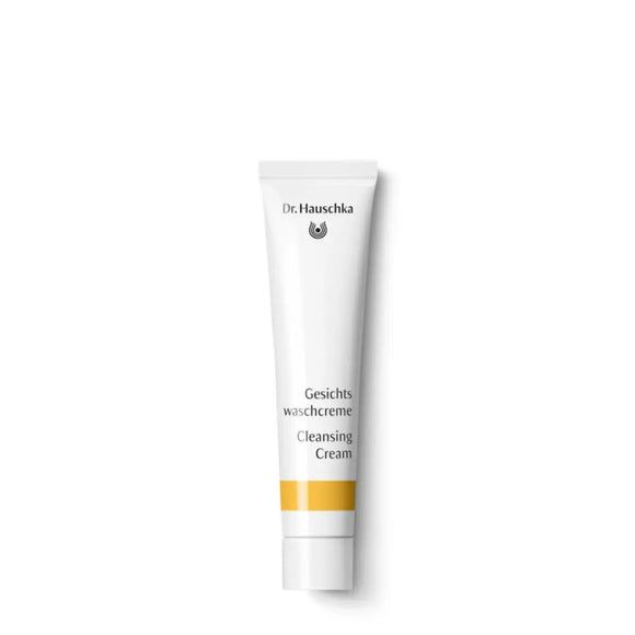 White tube of Dr. Hauschka Cleansing Cream with yellow accent stripe.