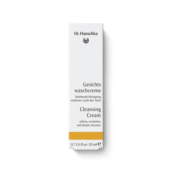 White Dr. Hauschka Cleansing Cream box with black and yellow text.
