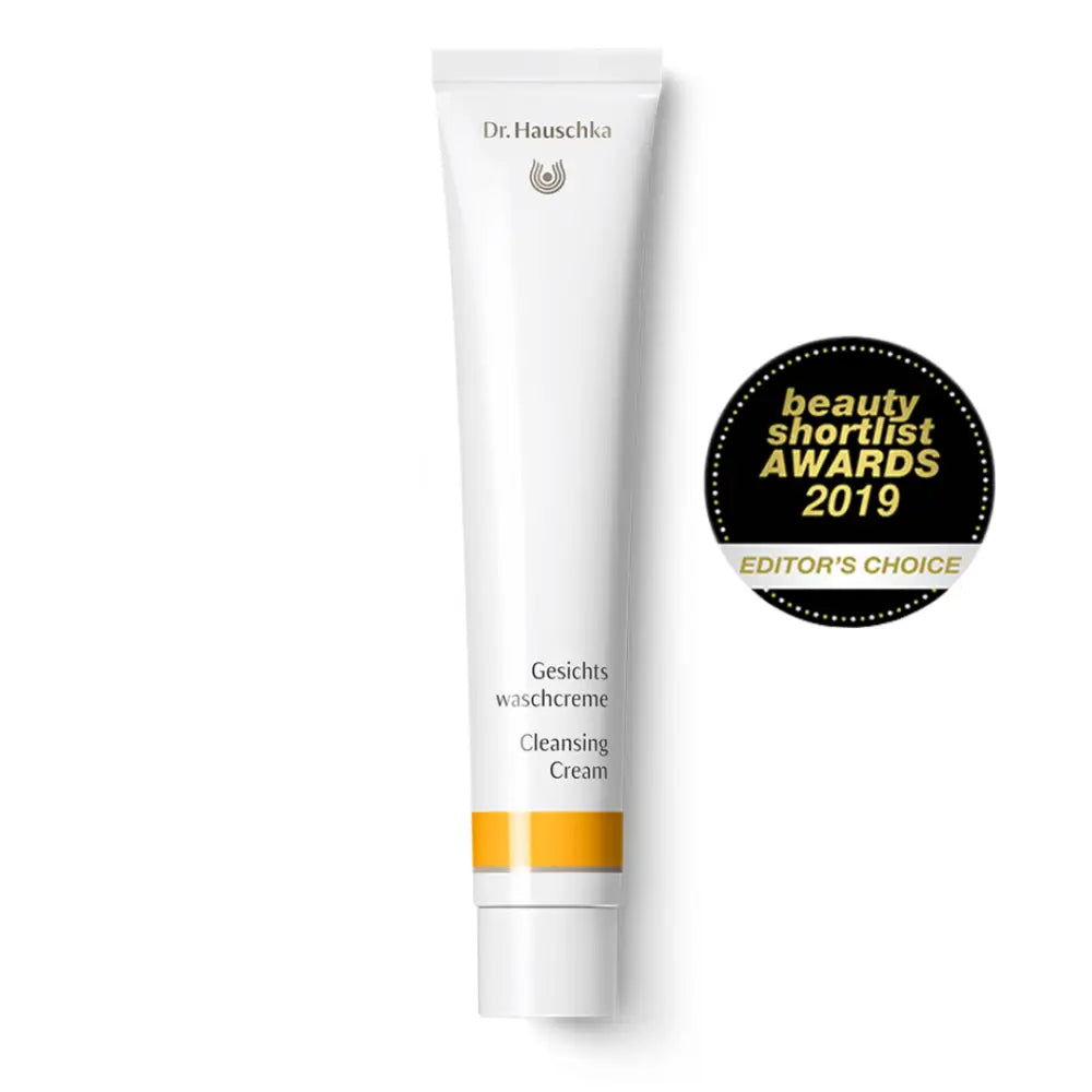 White tube of Dr. Hauschka Cleansing Cream with a beauty award seal.