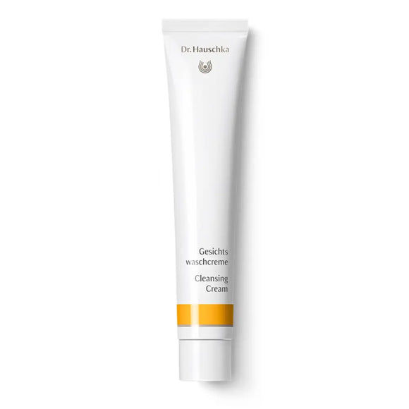 White tube of Dr. Hauschka Cleansing Cream with orange accent stripes.