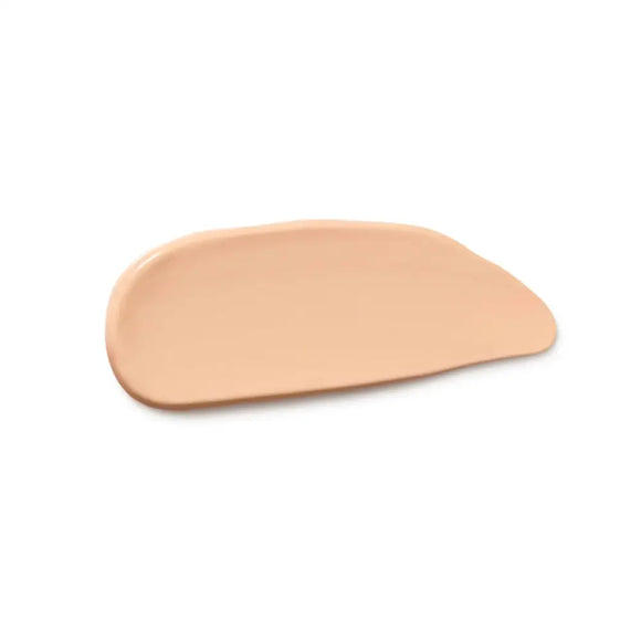 Smeared beige liquid foundation or concealer makeup sample.