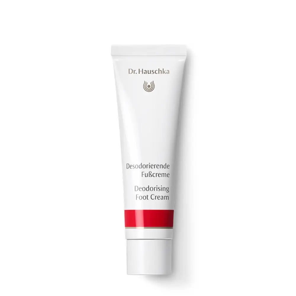 White tube of Dr. Hauschka Deodorizing Foot Cream with a red stripe.